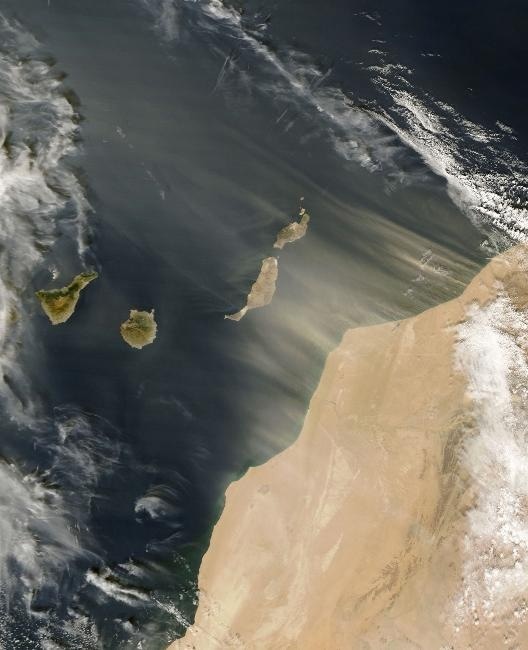 Saharan dust blowing off the west coast of Africa and over the Canary Islands (a Spanish archipelago). Image credit: CIA Factbook